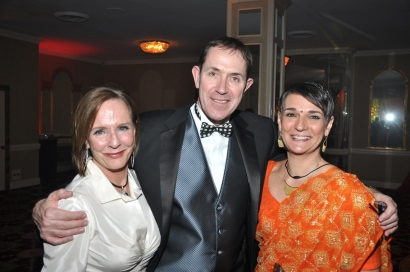 Michael Pink poses with two guests at the ball in 2012