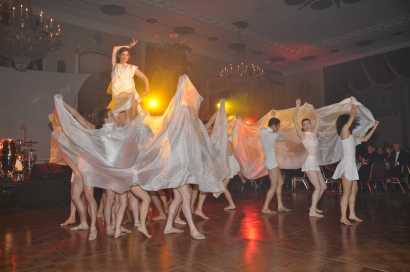 company dancers perform at the ball in white costumes