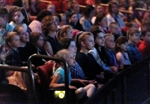 children watching in their seats