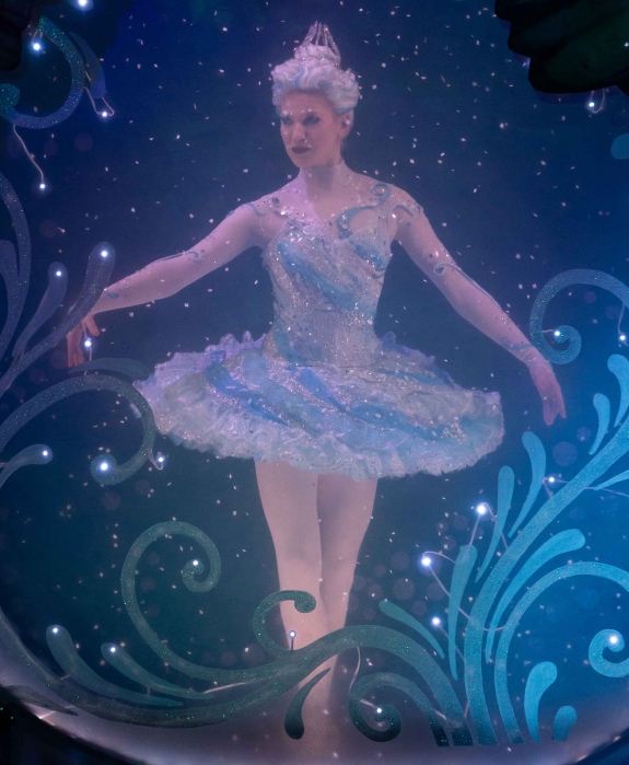 the Snow Queen dancing in a snow globe