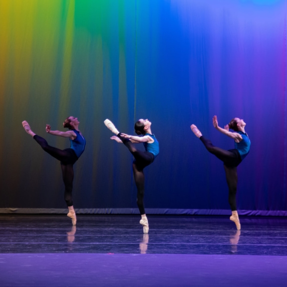 a group of women dancing on stage