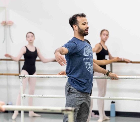 a teacher, and company member, Randy Crespo demonstrating in class